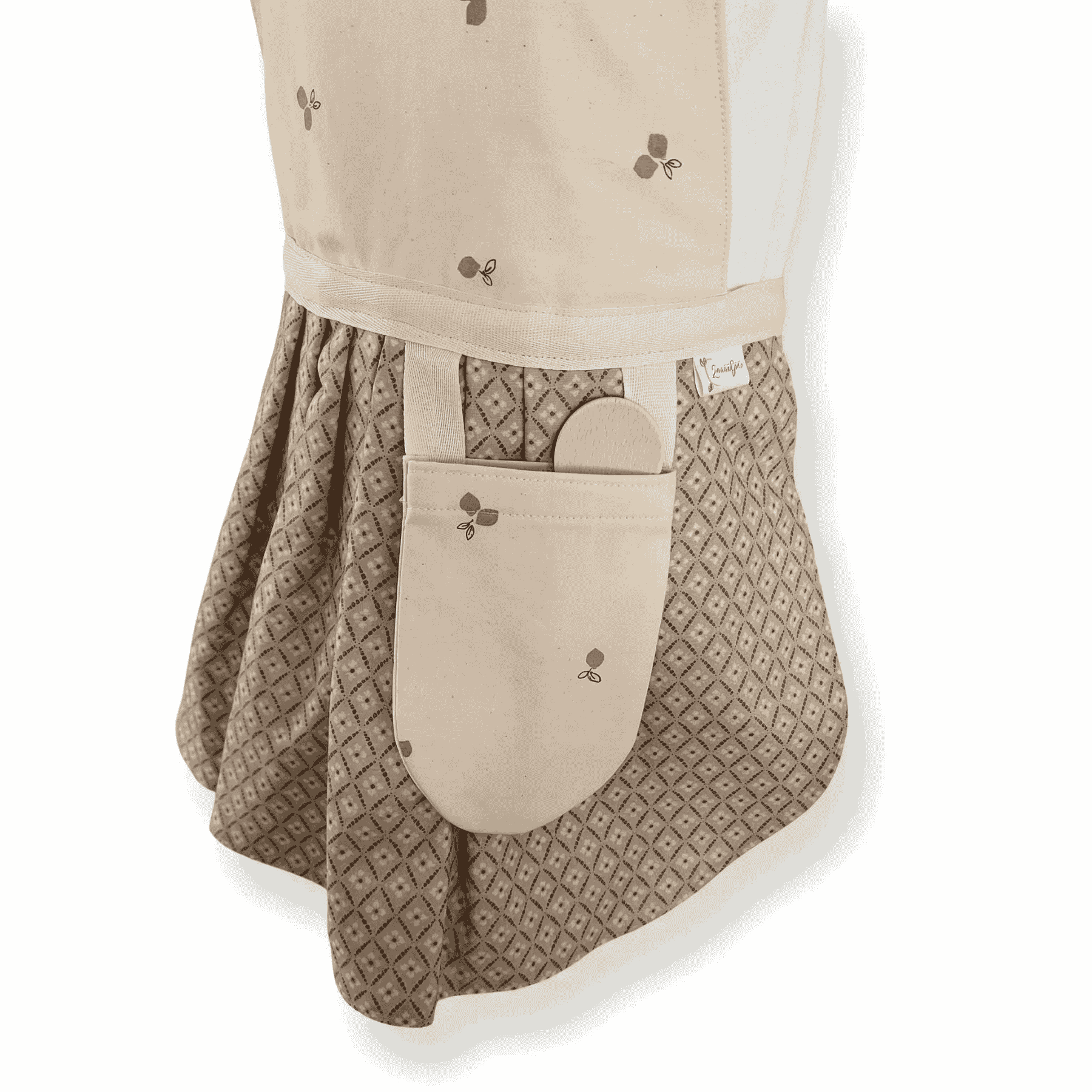 Detail geplooide rok kinderschortje bloemen stof beige grijsblauw, OEKO-TEX gecertificeerd Leonietje's